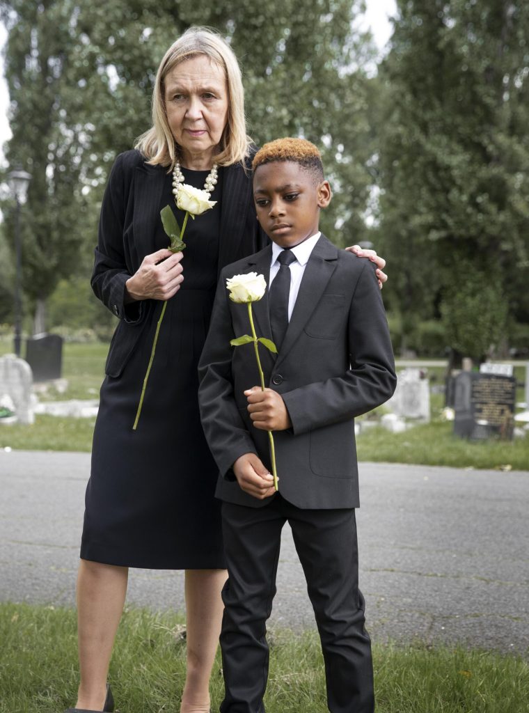 family-visiting-grave-loved-one